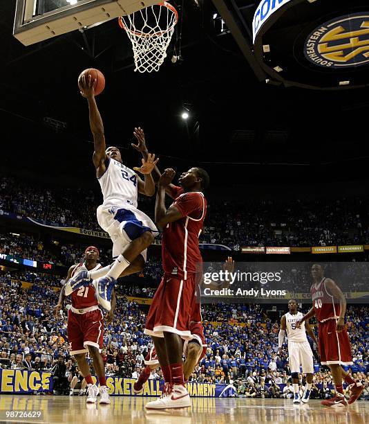 Eric Bledsoe of the Kentucky Wildcats drives for a shot attempt against the Alabama Crimson Tide during the quarterfinals of the SEC Men's Basketball...