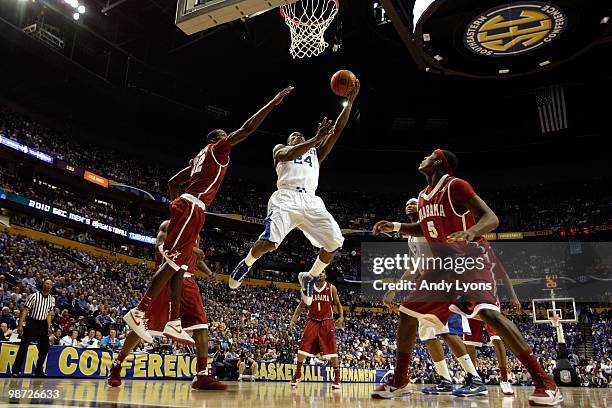 Eric Bledsoe of the Kentucky Wildcats drives for a shot attempt against the Alabama Crimson Tide during the quarterfinals of the SEC Men's Basketball...