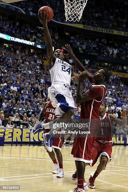 Eric Bledsoe of the Kentucky Wildcats drives for a shot attempt against the Alabama Crimson Tide during the quarterfinals of the SEC Men's Basketball...