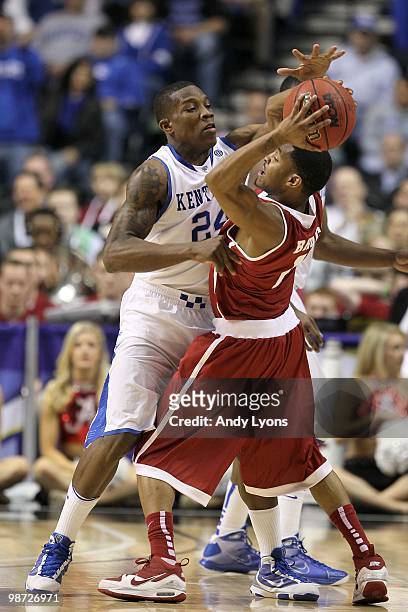 Eric Bledsoe of the Kentucky Wildcats defends against the Alabama Crimson Tide during the quarterfinals of the SEC Men's Basketball Tournament at the...
