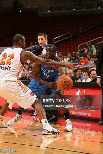 Moses Ehambe of the Tulsa 66ers passes the ball against Jeff Trepagnier of the Iowa Energy in Game Two of the Semifinal seriesof the D-League...