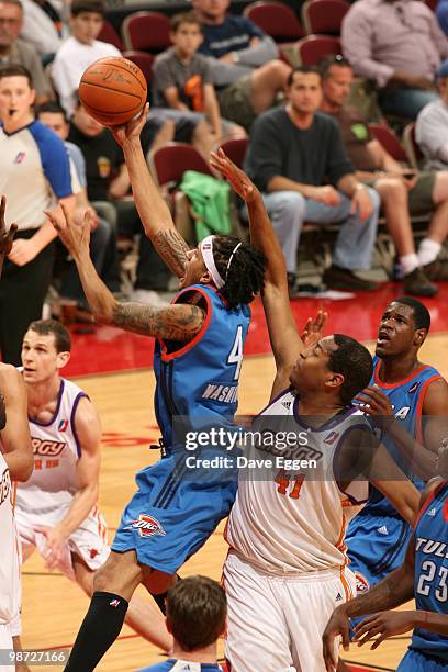 Deron Washington of the Tulsa 66ers lays up a shot past Darian Townes of the Iowa Energy in Game Two of the Semifinal seriesof the D-League playoffs...