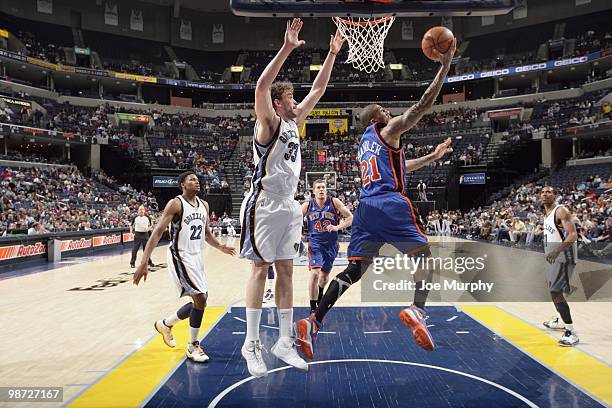 Wilson Chandler of the New York Knicks makes a layup against Marc Gasol of the Memphis Grizzlie on March 12, 2010 at FedExForum in Memphis,...