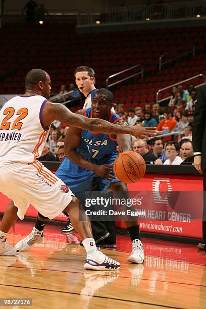 Moses Ehambe of the Tulsa 66ers passes the ball against Jeff Trepagnier of the Iowa Energy in Game Two of the Semifinal seriesof the D-League...