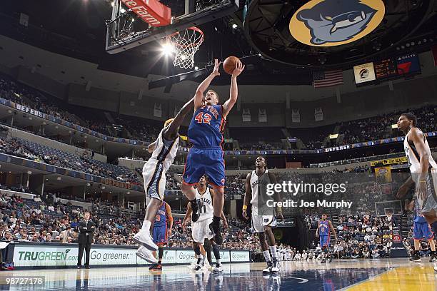 David Lee of the New York Knicks puts a shot up against Zach Randolph of the Memphis Grizzlie on March 12, 2010 at FedExForum in Memphis, Tennessee....