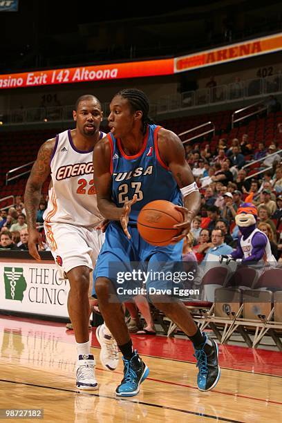 Larry Owens of the Tulsa 66ers looks to make a pass play as Jeff Trepagnier of the Iowa Energy looks on in Game Two of the Semifinal seriesof the...