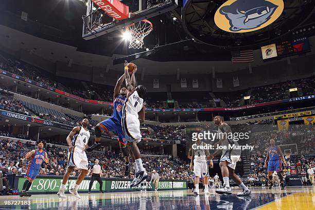 Eddie House of the New York Knicks puts a shot up against DeMarre Carroll of the Memphis Grizzlie on March 12, 2010 at FedExForum in Memphis,...