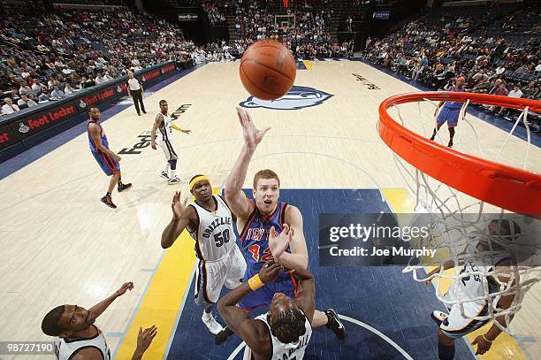 David Lee of the New York Knicks puts a shot up against Zach Randolph of the Memphis Grizzlies on March 12, 2010 at FedExForum in Memphis, Tennessee....