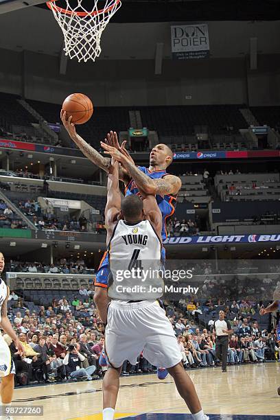 Wilson Chandler of the New York Knicks puts a shot up against Sam Young of the Memphis Grizzlie on March 12, 2010 at FedExForum in Memphis,...