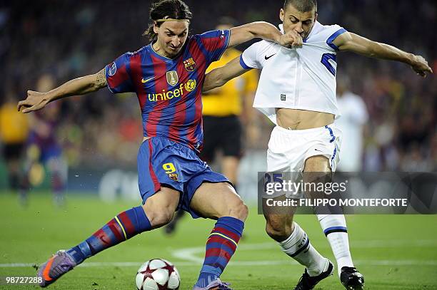 Barcelona's Swedish forward Zlatan Ibrahimovic vies with Inter Milan's Argentinian defender Walter Andrian Samuel during their Champion's League...