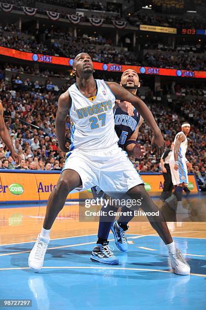 Johan Petro of the Denver Nuggets boxes out Carlos Boozer of the Utah Jazz in Game Two of the Western Conference Quarterfinals during the 2010 NBA...