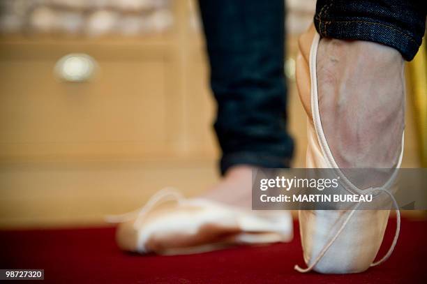 French ballet dancer Daphne Gestin tries a pair of ballet shoes at Repetto store on March 19, 2010 in Paris. Created in 1947 by Rose Repetto, at the...