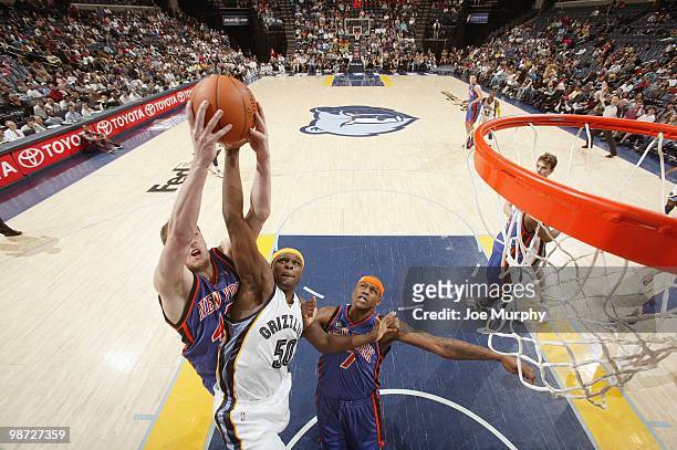 David Lee of the New York Knicks leaps for a rebound against Zach Randolph of the Memphis Grizzlie on March 12, 2010 at FedExForum in Memphis,...
