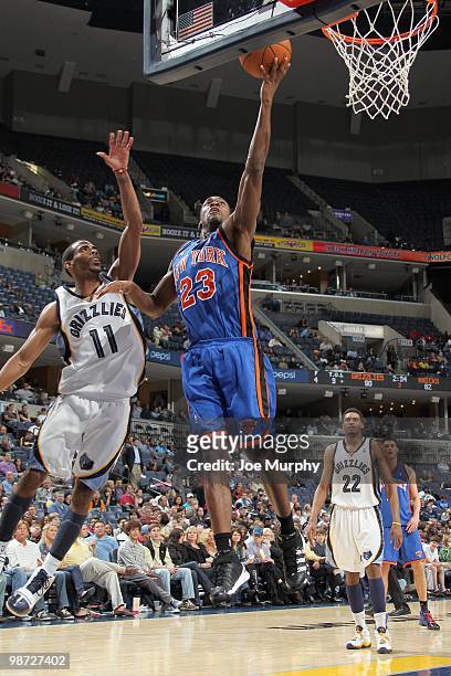 Toney Douglas of the New York Knicks puts a shot up against Mike Conley of the Memphis Grizzlie on March 12, 2010 at FedExForum in Memphis,...