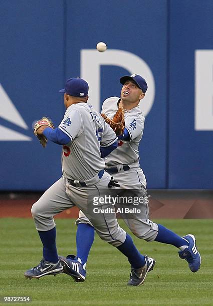 Reed Johnson of the Los Angeles Dodgers makes a catch as Rafael Furcal gets out of the way against the New York Mets during their game on April 27,...