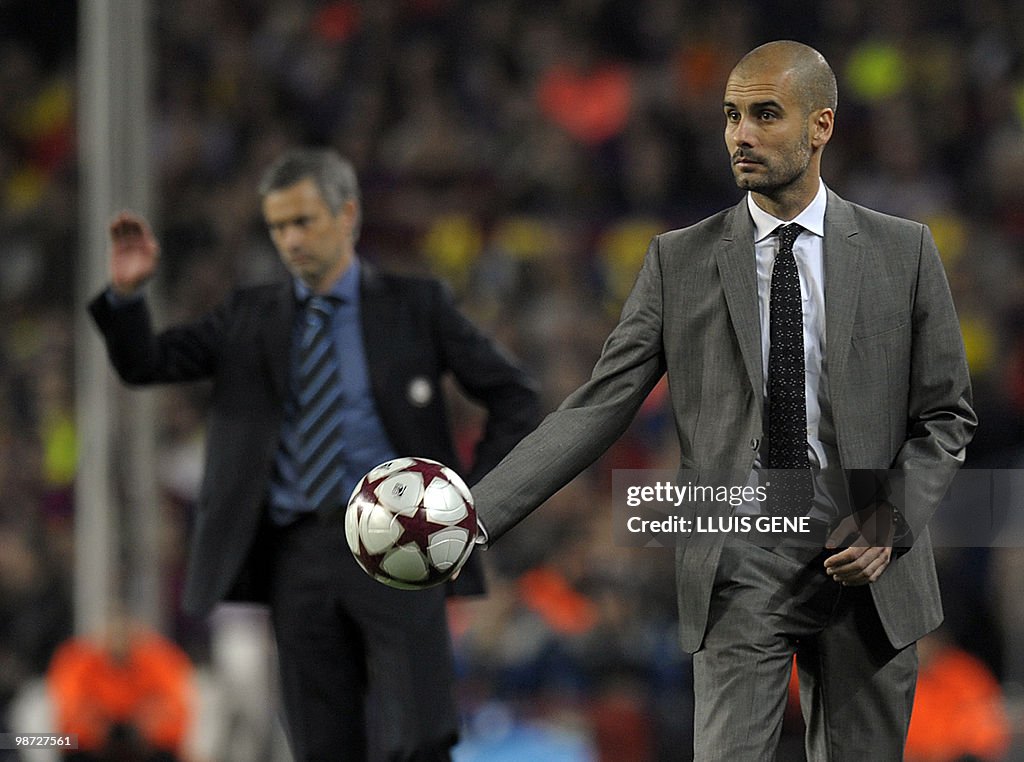 Barcelona's coach Pep Guardiola holds th