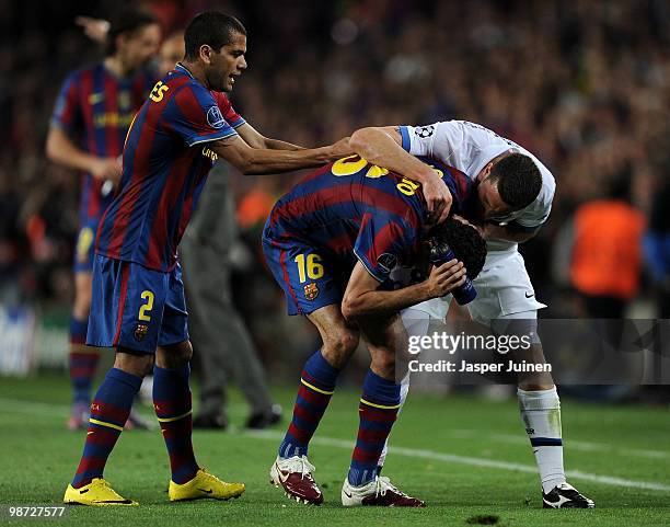 Thiago Motta of Inter Milan argues with Sergio Busquets of FC Barcelona after being sent off with a red card as Daniel Alves intervenes, during the...