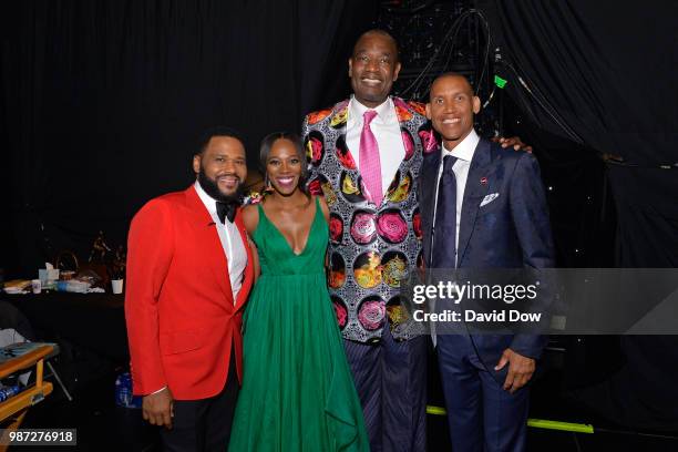 Anthony Anderson, Yvonne Orji, Dikembe Mutombo, and Reggie Miller pose for a photo at the NBA Awards Show on June 25, 2018 at the Barker Hangar in...