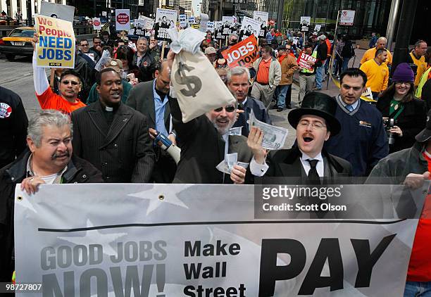 Hundreds of labor union workers march through the financial district calling for job creation and financial reform on April 28, 2010 in Chicago,...