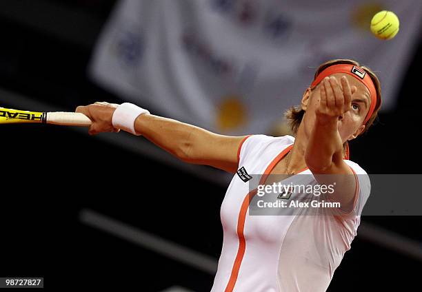 Svetlana Kuznetsova of Russia serves the ball during her second round match against Na Li of China at day three of the WTA Porsche Tennis Grand Prix...