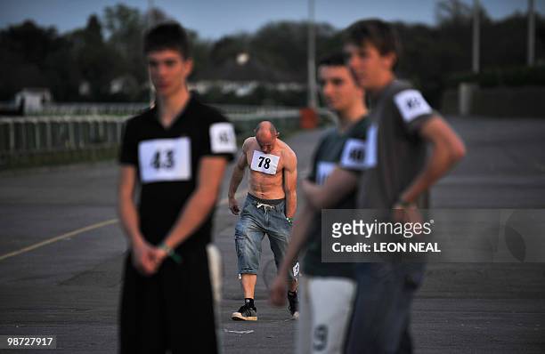 Competitors prepare for the "People's Cup" race at Kempton Park race track at Sunbury on Thames in Middlesex on April 28, 2010. The race was the...