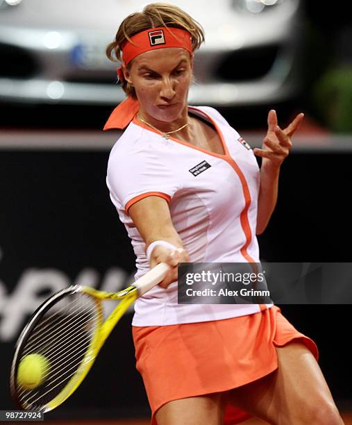 Svetlana Kuznetsova of Russia plays a forehand during her second round match against Na Li of China at day three of the WTA Porsche Tennis Grand Prix...