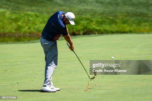 Marc Leishman of Australia hits his second shot on the fourth hole during the second round of the Quicken Loans National at TPC Potomac at Avenel...