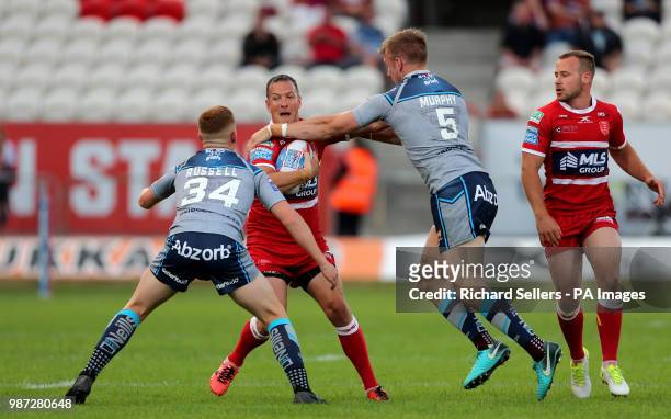 Hull KR's Danny McGuire is tackled by Huddersfield Giants Aaron Murphy during the Betfred Super League match at Craven Park, Hull.
