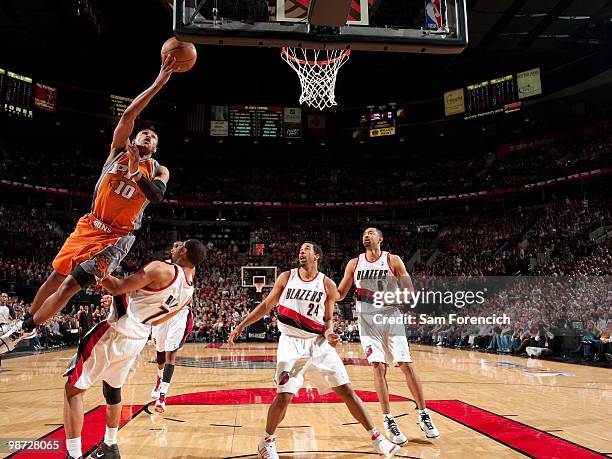 Leandro Barbosa of the Phoenix Suns shoots a layup against Brandon Roy, Andre Miller and Juwan Howard of the Portland Trail Blazers in Game Four of...