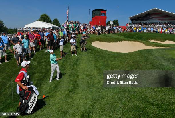 Bill Haas plays a wedge shot on the 16th hole during the second round of the Quicken Loans National at TPC Potomac at Avenel Farm on June 29, 2018 in...