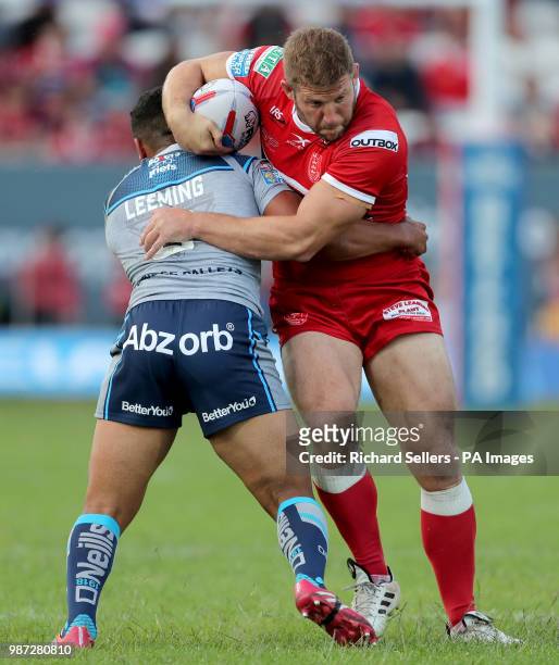 Hull KR's Nick Scruton is tackled by Huddersfield Giants Kruise Leeming during the Betfred Super League match at Craven Park, Hull.