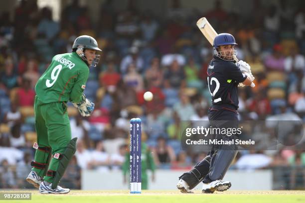 Ravi Bopara of England cuts sas wicketkeeper Rahim Mushfiqur looks onduring the ICC T20 World Cup warm up match at the Kensington Oval on April 28,...