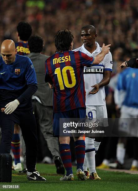 Lionel Messi of FC Barcelona argues with his former teammate Samuel Eto'o of Inter Milan after Thiago Motta of Inter Milan was red carded, during the...