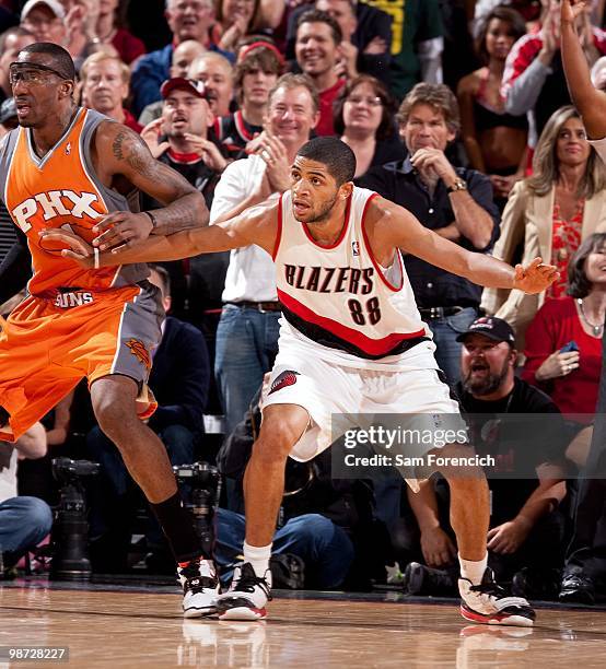 Nicolas Batum of the Portland Trail Blazers guards Amar'e Stoudemire of the Phoenix Suns in Game Four of the Western Conference Quarterfinals during...