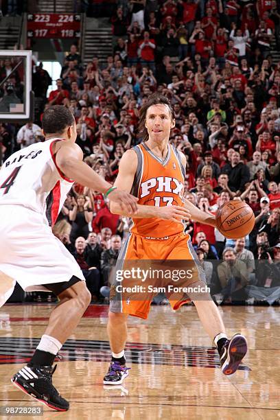 Steve Nash of the Phoenix Suns moves the ball up court against Jerryd Bayless of the Portland Trail Blazers in Game Four of the Western Conference...