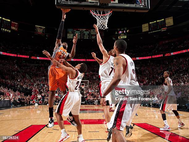 Amar'e Stoudemire of the Phoenix Suns shoots a layup against Andre Miller, Brandon Roy and Marcus Camby of the Portland Trail Blazers in Game Four of...