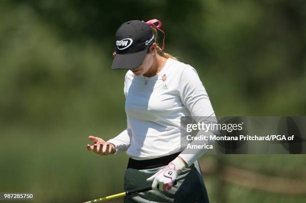 Paula Creamer of the US reacts to her hand after hitting her tee shot on the 18th hole during the second round of the 2018 KPMG Women's PGA...