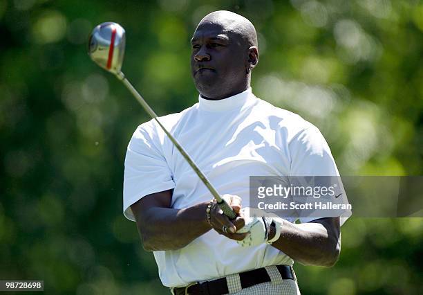 Basketball legend Michael Jordan hits a shot during the pro am prior to the start of the 2010 Quail Hollow Championship at the Quail Hollow Club on...