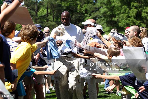 Basketball legend Michael Jordan signs autographs for fans during the pro am prior to the start of the 2010 Quail Hollow Championship at the Quail...