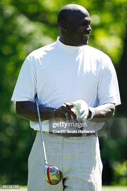Basketball legend Michael Jordan walks off a tee box during the pro am prior to the start of the 2010 Quail Hollow Championship at the Quail Hollow...