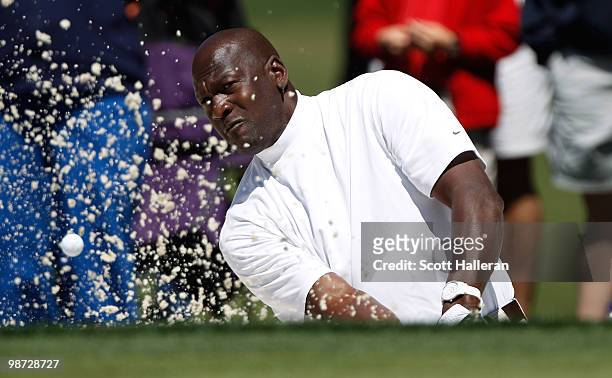 Basketball legend Michael Jordan hits a bunker shot during the pro am prior to the start of the 2010 Quail Hollow Championship at the Quail Hollow...
