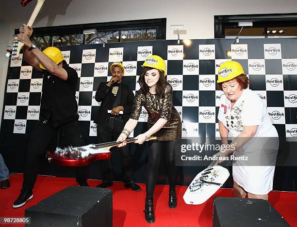 Singer Amy Macdonald smashes a guitar at the Hard Rock Cafe Berlin re-opening on April 28, 2010 in Berlin, Germany.