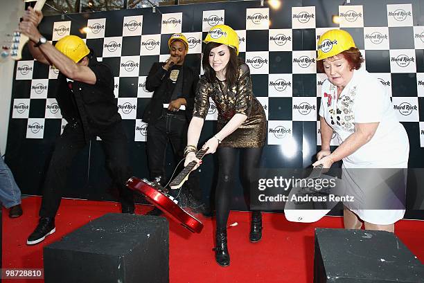 Singer Amy Macdonald smashes a guitar at the Hard Rock Cafe Berlin re-opening on April 28, 2010 in Berlin, Germany.