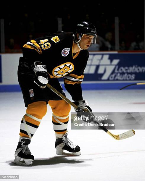 Joe Juneau of the Boston Bruins skates against the Montreal Canadiens in the early 1990's at the Montreal Forum in Montreal, Quebec, Canada.