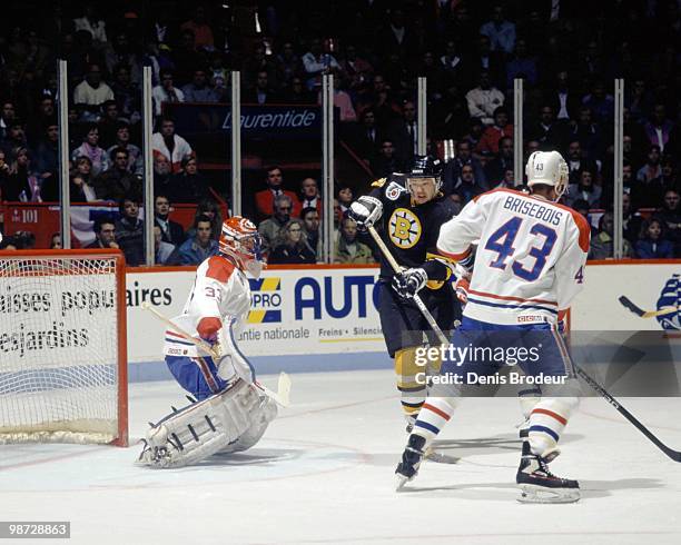 Joe Juneau of the Boston Bruins skates against the Montreal Canadiens in the early 1990's at the Montreal Forum in Montreal, Quebec, Canada.