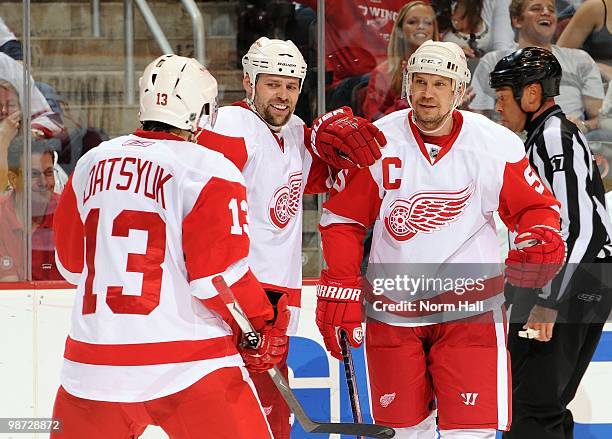 Nicklas Lidstrom and Tomas Holmstrom of the Detroit Red Wings celebrates a goal against the Phoenix Coyotes with teammate Pavel Datsyuk in Game Seven...