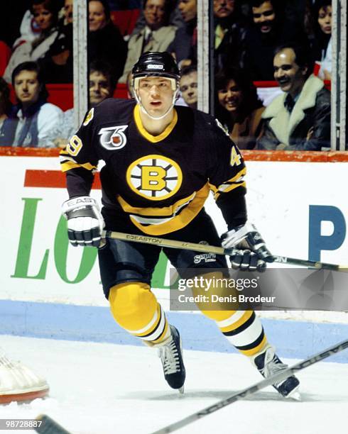 Joe Juneau of the Boston Bruins skates against the Montreal Canadiens in the early 1990's at the Montreal Forum in Montreal, Quebec, Canada.