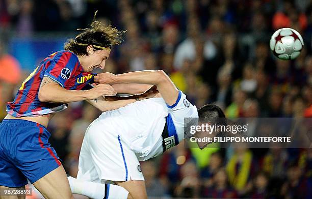 Barcelona's Swedish forward Zlatan Ibrahimovic vies with Inter Milan's Brazilian defender Lucio Da Silva Ferreira Lucimar during the UEFA Champions...