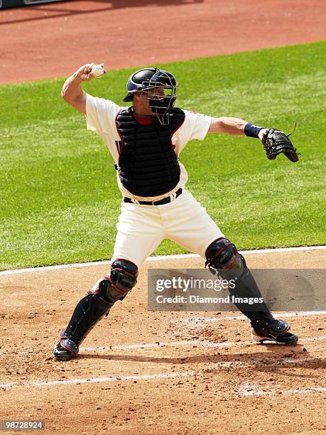 Catcher Mike Redmond of the Cleveland Indians throws the ball to second base during a game on April 12, 2010 against the Texas Rangers at Progressive...