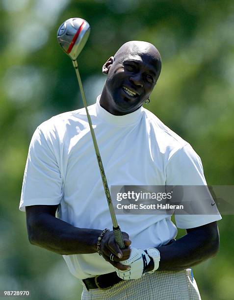 Basketball legend Michael Jordan watches a shot during the pro am prior to the start of the 2010 Quail Hollow Championship at the Quail Hollow Club...